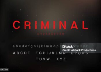 Scratched criminal theme alphabet font set with uppercase lowercase and numbers on dark backround