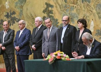 China's Foreign Minister Wang Yi, fourth left, looks on, while hosting an event of signing of the "Beijing declaration" between Palestinian factions, Fatah and Hamas, at the Diaoyutai State Guesthouse in Beijing, Tuesday, July 23, 2024. Mahmoud al-Aloul of Fatah, third left, and Mussa Abu Marzuk of Hamas, third right, are seen. (Pedro Pardo/Pool Photo via AP)